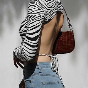 Zebra cut out open back shirt high neck